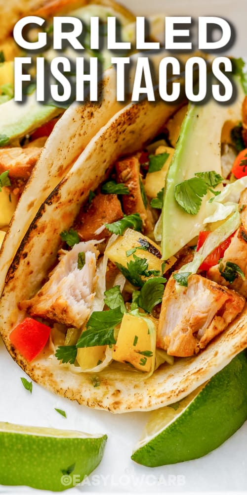 grilled fish tacos topped with cilantro with text