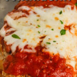 close up of Low Carb Baked Chicken Parmesan in a dish with a title