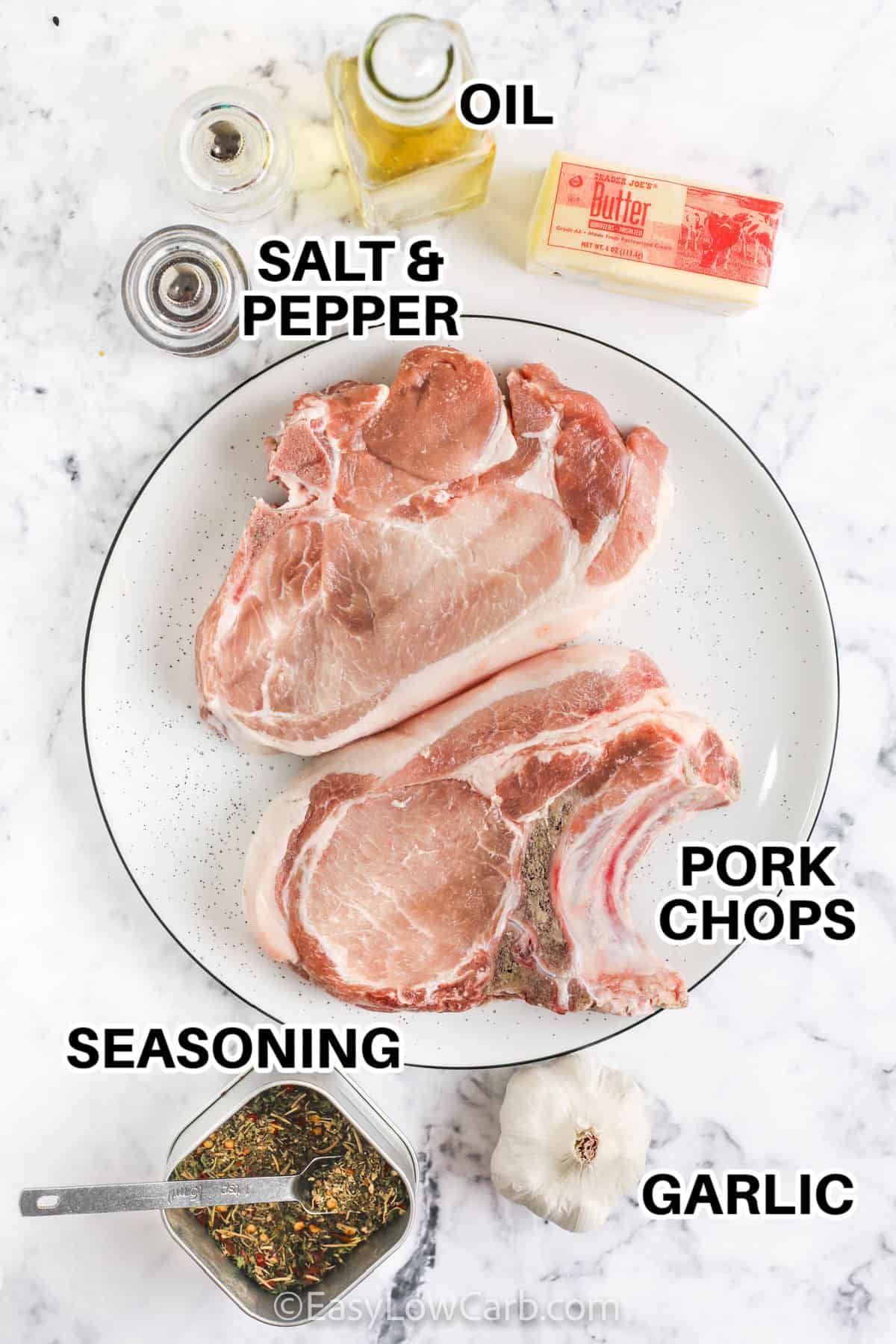 raw pork chops, garlic, seasoning, salt and pepper , oil and butter to make Creamy Skillet Pork Chops with labels