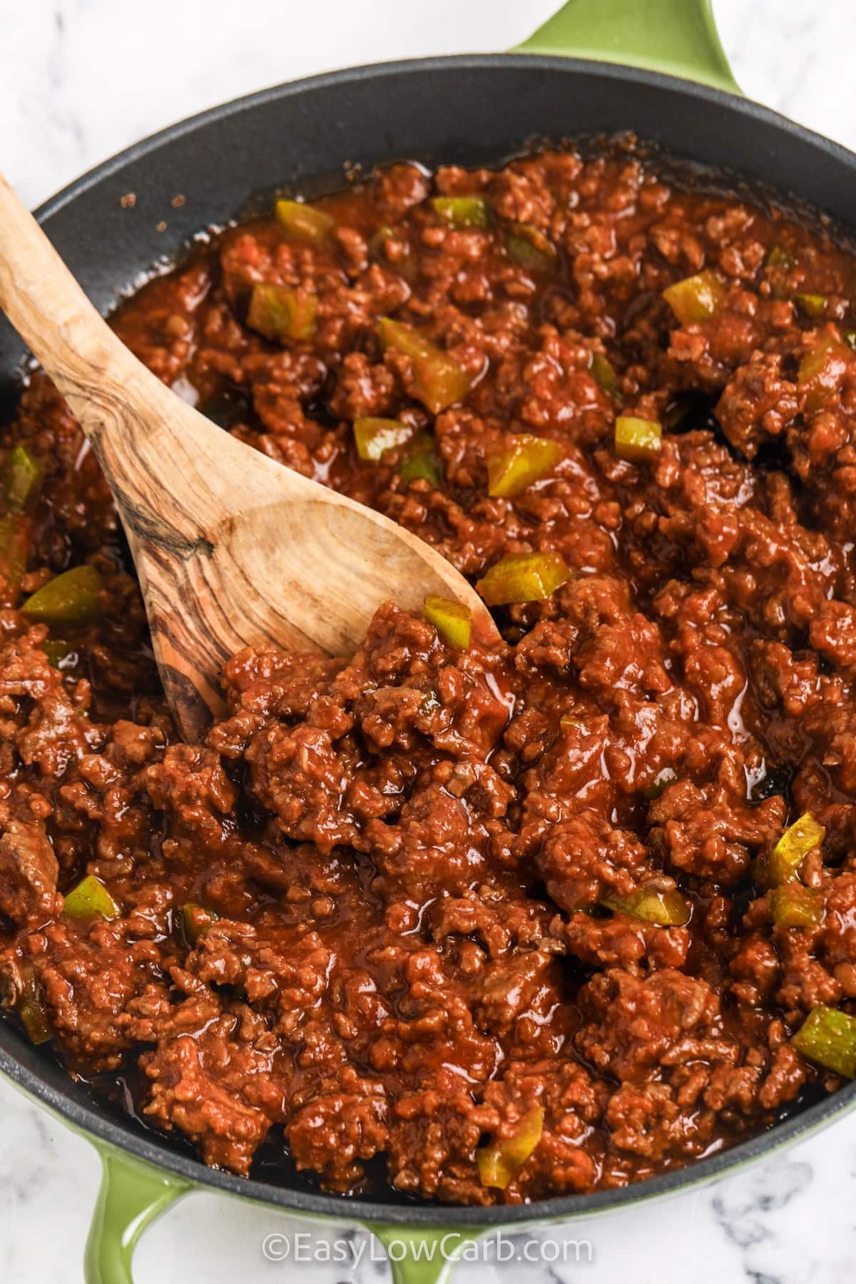 Keto Sloppy Joes in a pan with a wooden spoon