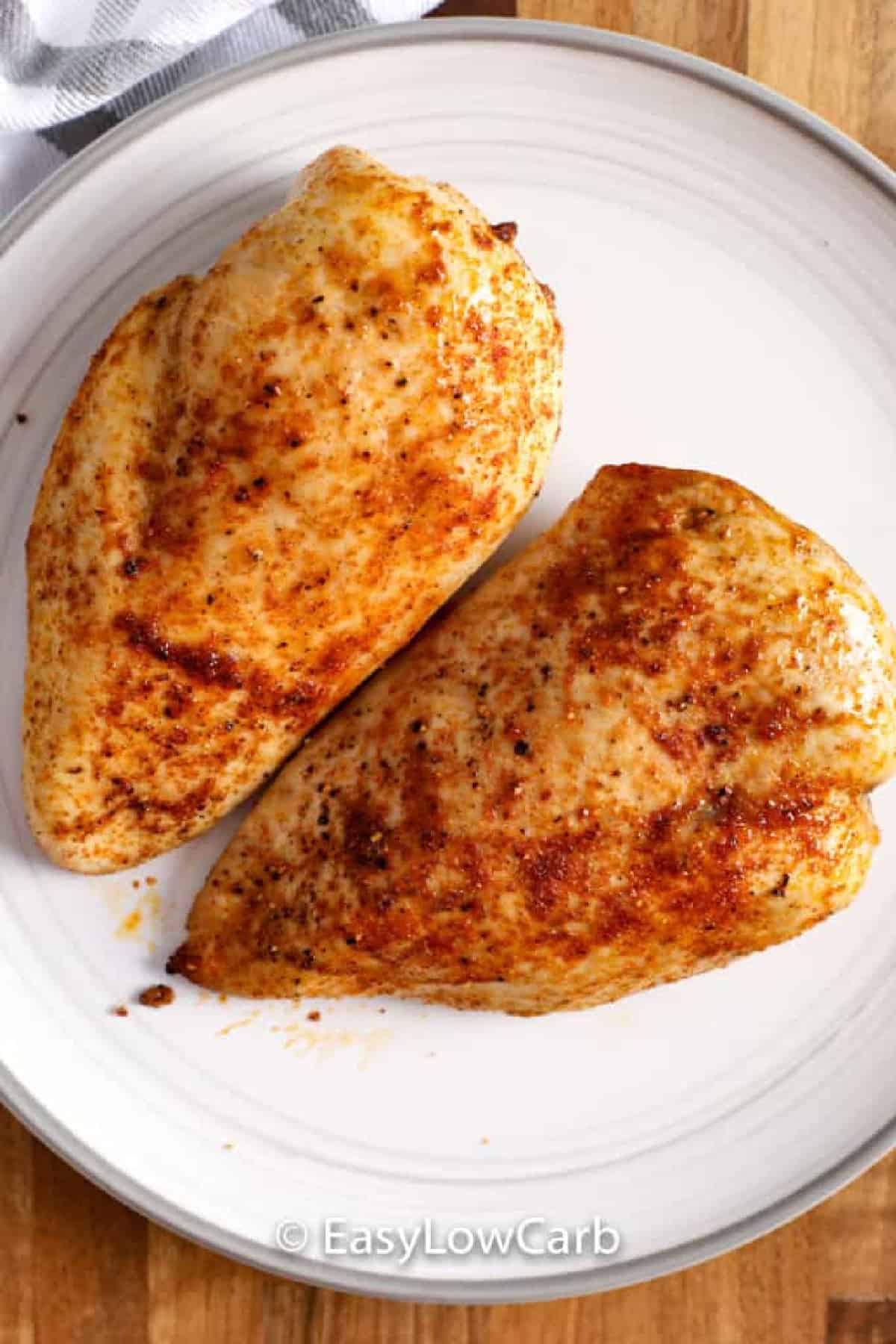 cooked Air Fryer Chicken Breasts on a white plate