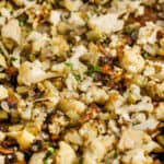 cooked Cauliflower Stuffing on a sheet pan with writing