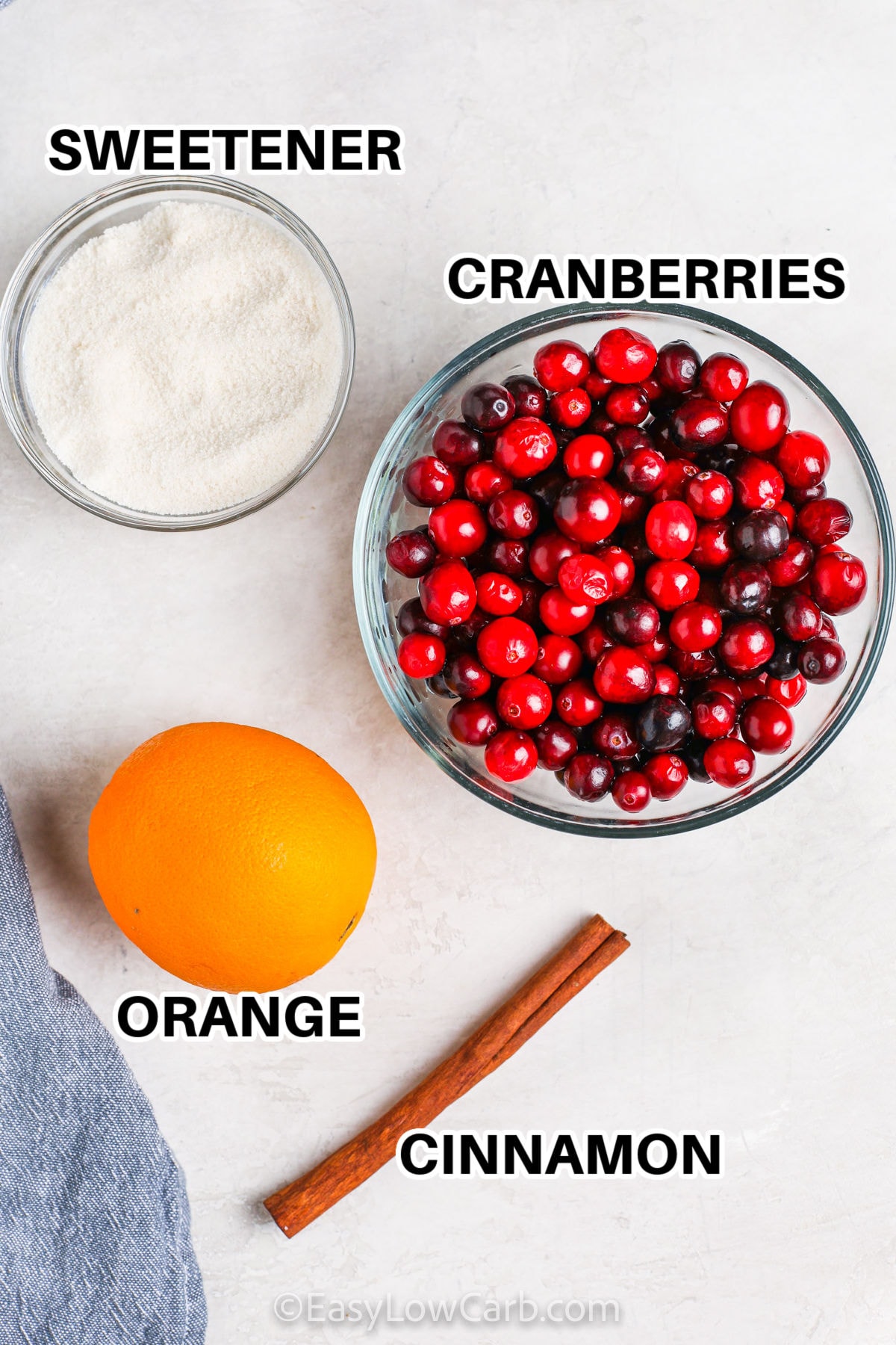 cranberries , sweetener, orange and cinnamon with labels to make Keto Cranberry Sauce