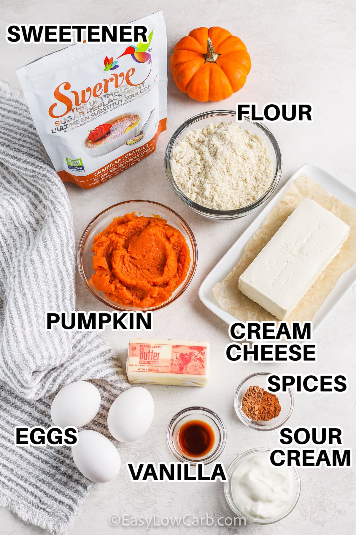 sweetener , almond flour , pumpkin , cream cheese , spices , vanilla , eggs and sour cream with labels to make Keto Pumpkin Cheesecake