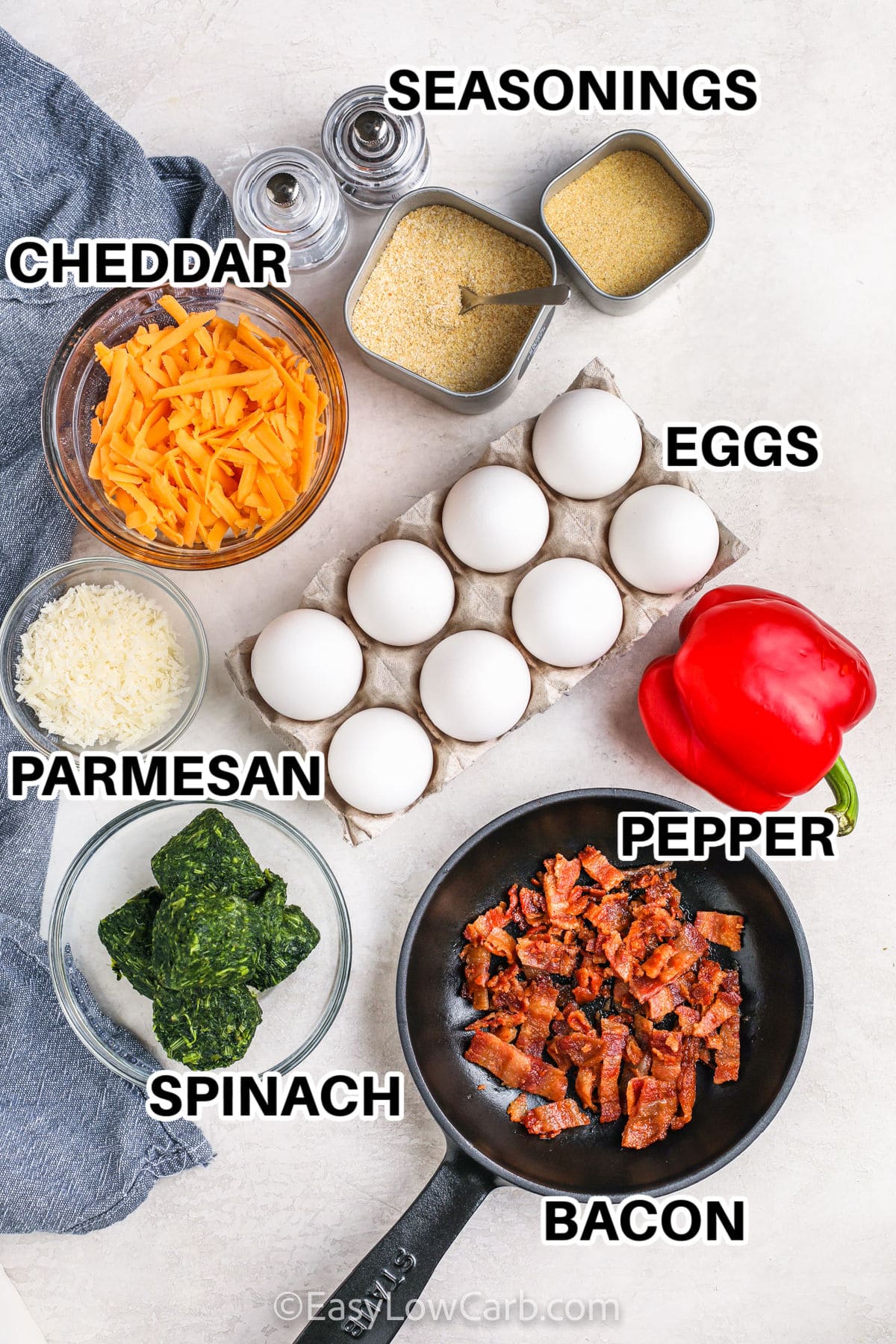 cheddar , parmesan, spinach , bacon , pepper , eggs and seasonings with labels to make Mini Quiches