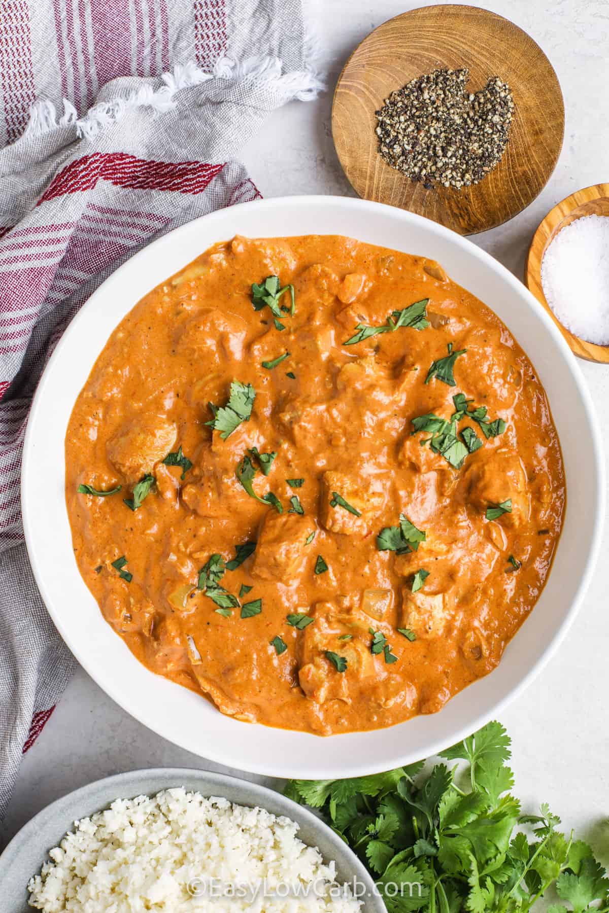 Keto Butter Chicken in a bowl with a bowl of rice