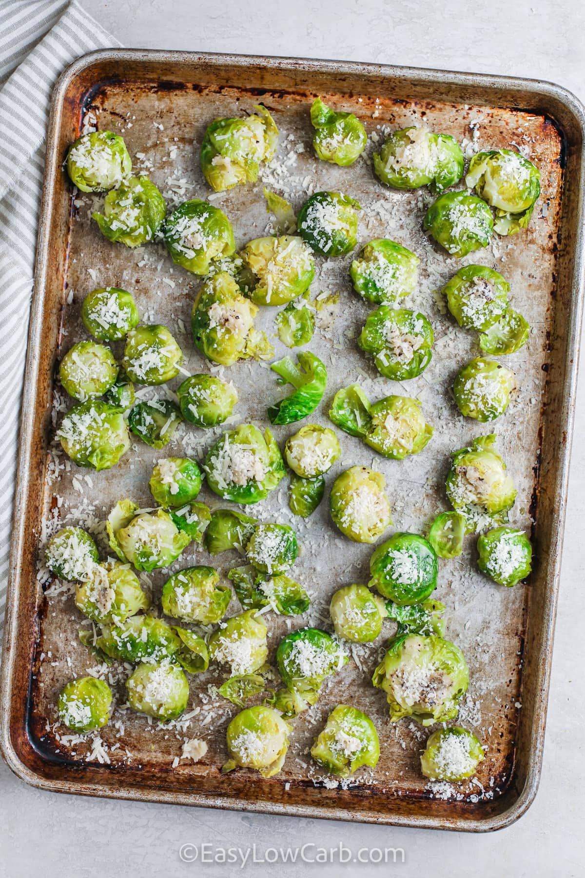 adding cheese to sprouts to make Smashed Brussel Sprouts Recipe