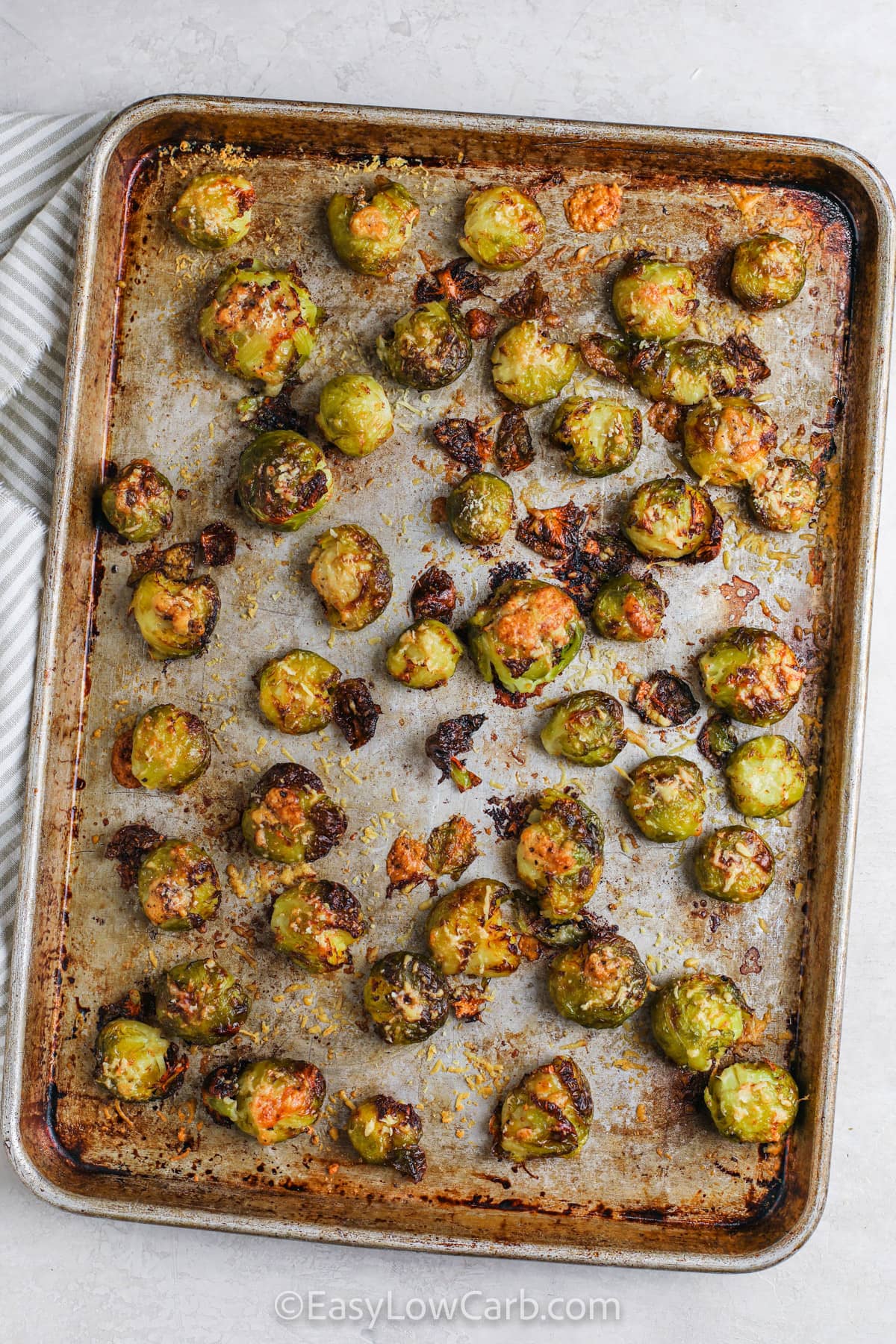 cooked Brussels sprouts on a sheet pan to make Smashed Brussel Sprouts