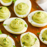 Avocado Deviled Eggs on a wooden board