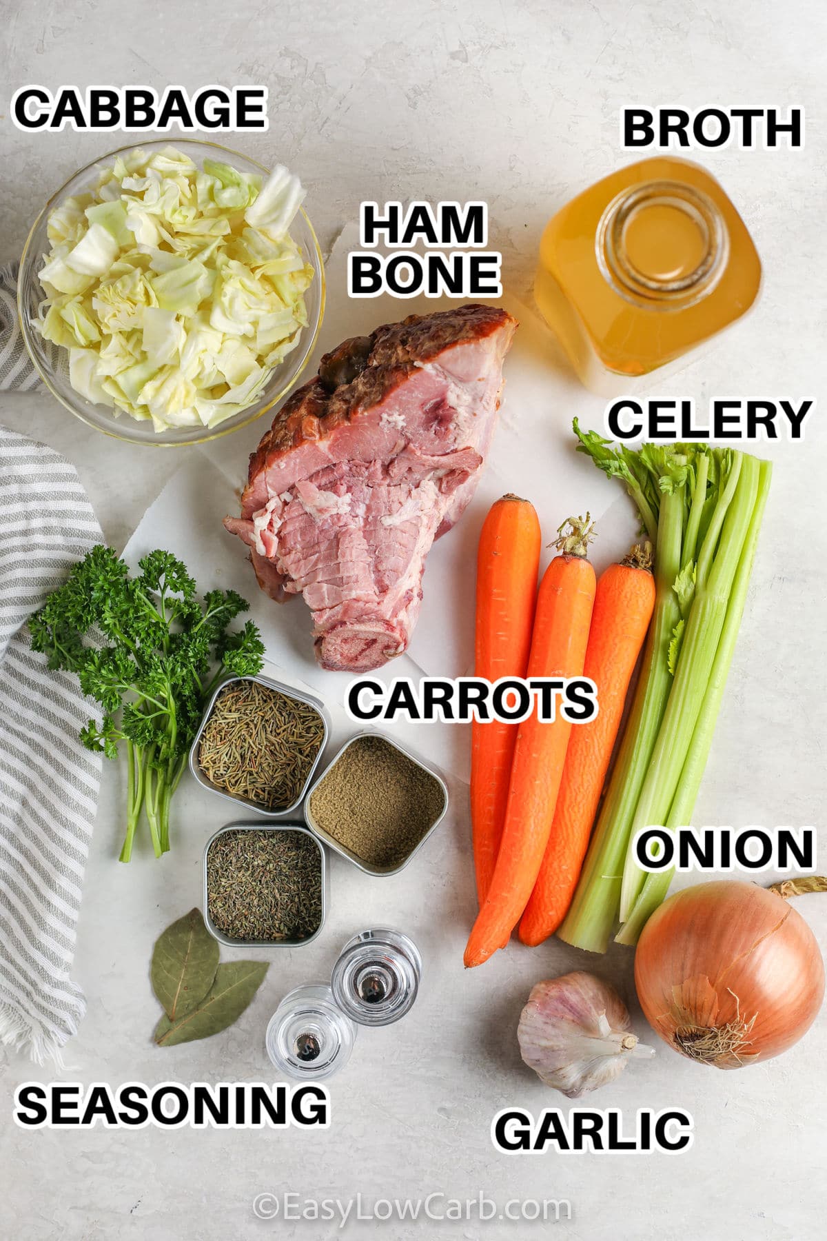 cabbage , ham bone , broth , celery , carrots , seasonings , garlic and onion with labels to make Low Carb Ham Bone Soup