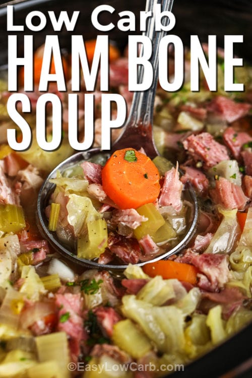 taking a spoonfull of Low Carb Ham Bone Soup out of the crockpot with writing