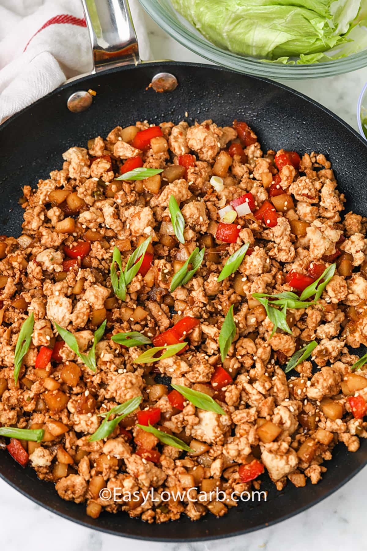 filling in a pan to make Easy Chicken Lettuce Wraps