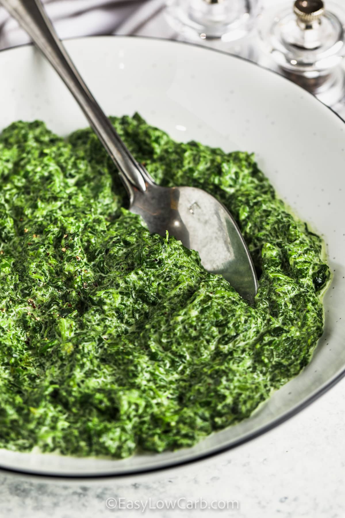 close up of Easy Creamed Spinach in a bowl