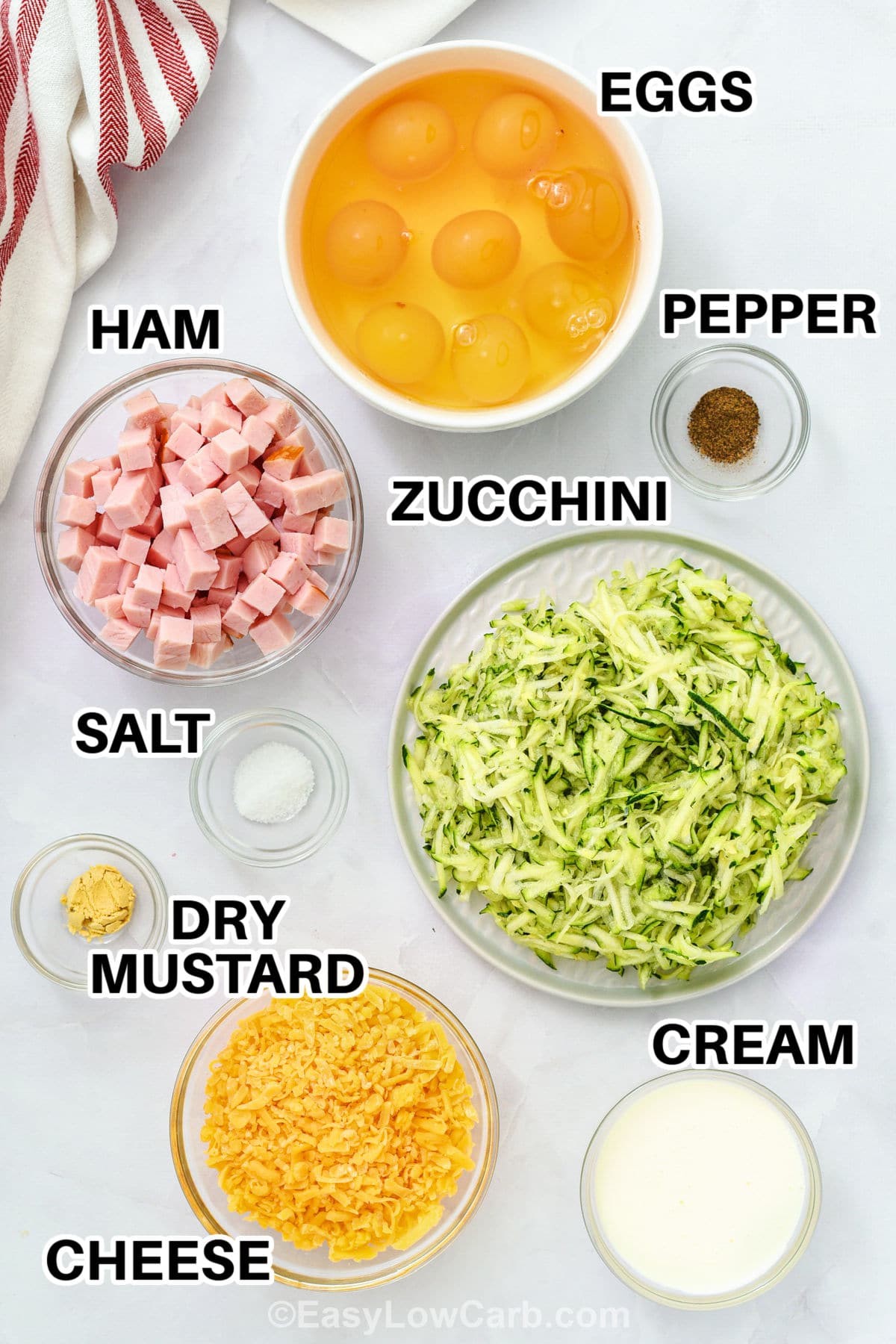 eggs , ham , zucchini , dry mustard , cheese , cream , salt and pepper with labels to make Crustless Ham and Cheese quiche