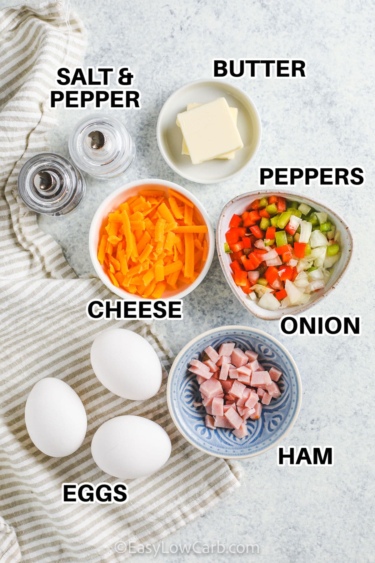 butter , peppers , cheese , onion , ham and eggs with labels to make Denver Omelet