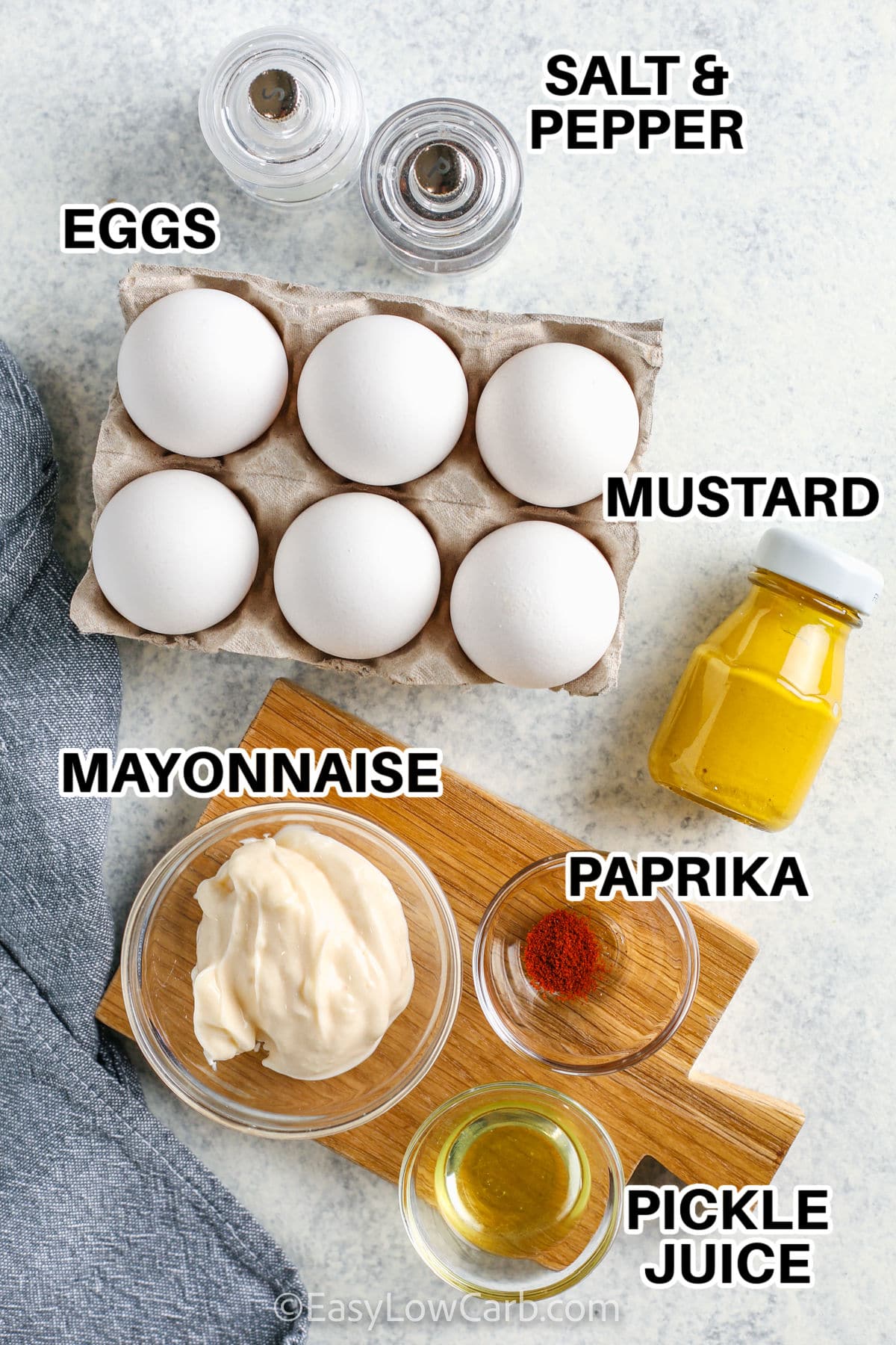 eggs , mustard , mayonnaise , paprika , pickle juice and salt with pepper to make Keto Deviled Eggs with labels