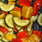 cooked Air Fryer Roasted Vegetables in the air fryer with writing