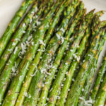 plated Oven-Roasted Asparagus With Lemon with parmesan and writing