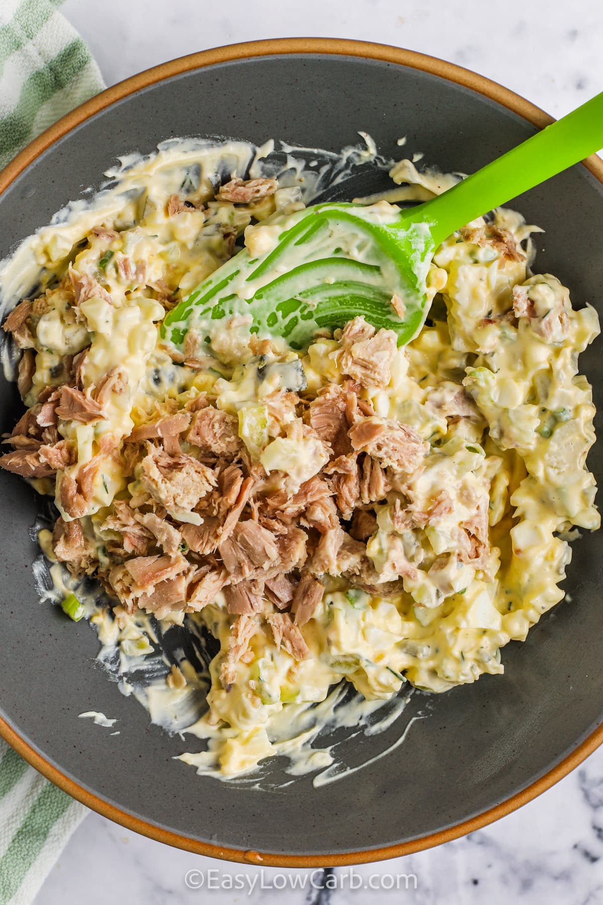 adding tuna to bowl to make Tuna Egg Salad