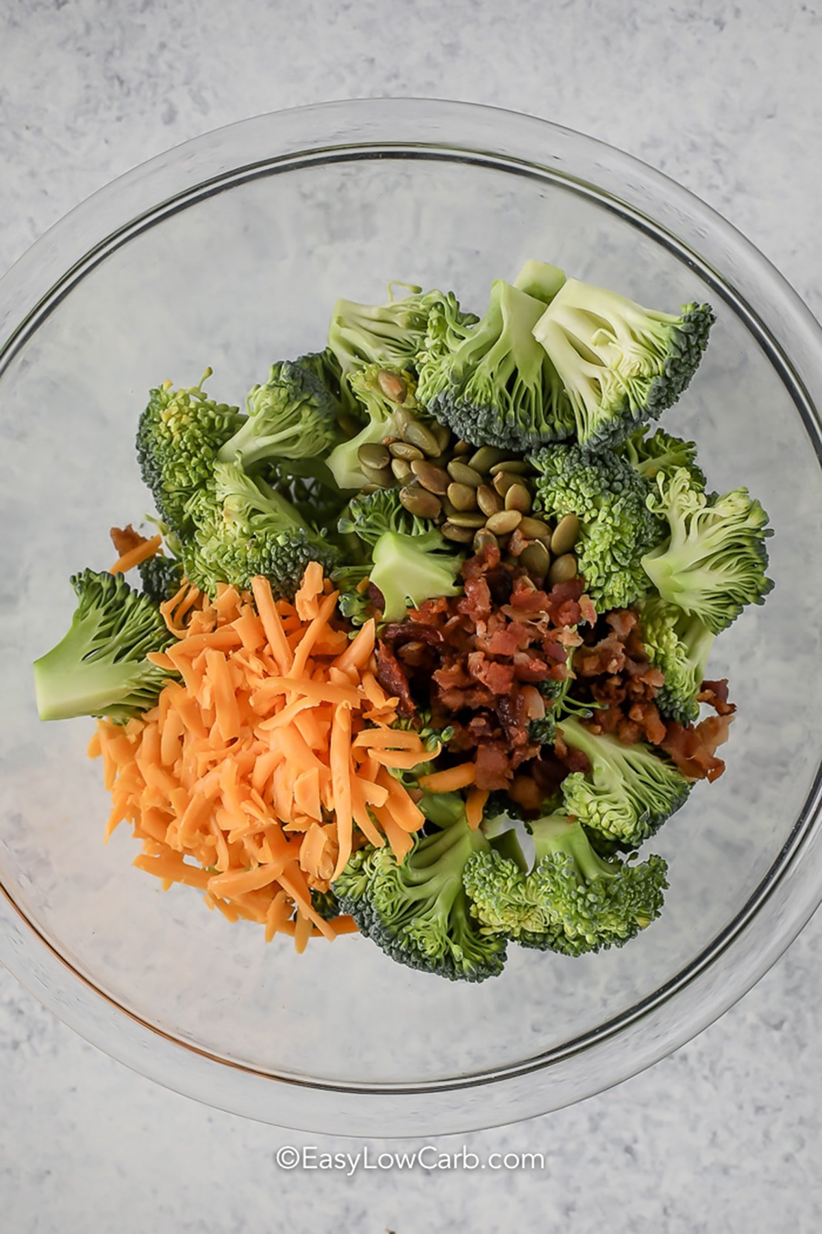 ingredients in a bowl to make Broccoli Bacon Salad Recipe