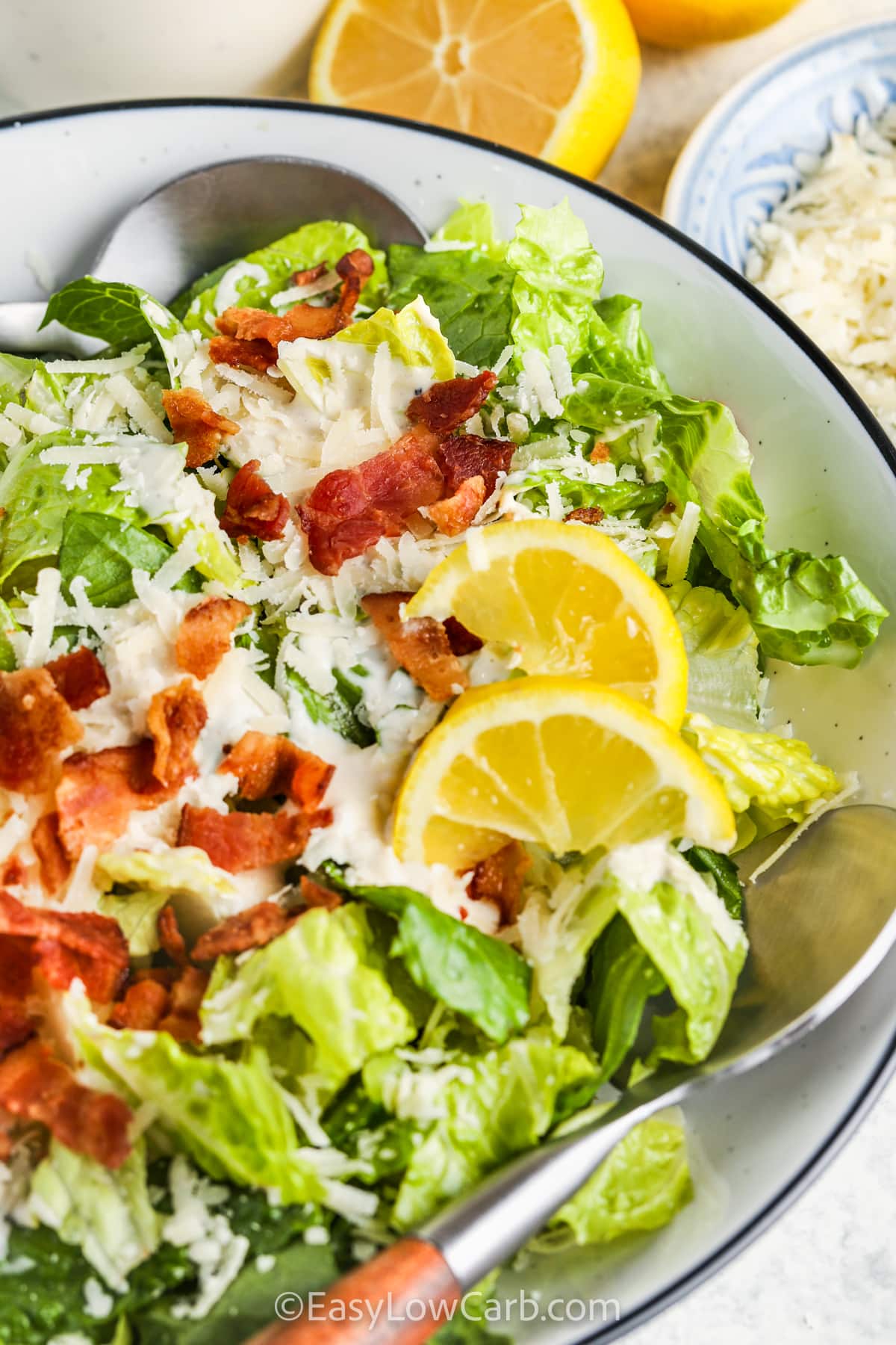 Keto Caesar salad is a fresh, low-carb salad that combines romaine lettuce, bacon, and a creamy homemade dressing. This keto Caesar salad recipe is simple, flavorful, and perfect for everyday meals. The Parmesan and garlic dressing adds bold taste while keeping it low-carb and satisfying. It works well as a side dish or topped with protein for a complete keto meal. #easylowcarb bowl of Low Carb Caesar Salad Recipe