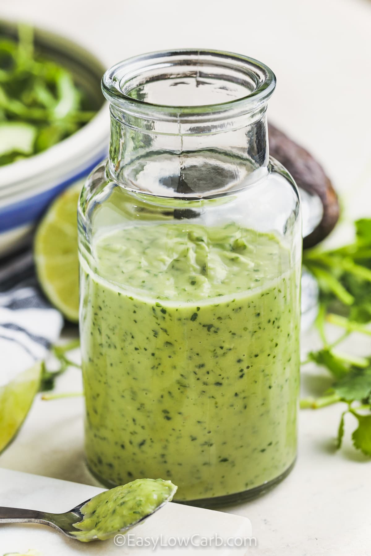 Avocado Lime Dressing with some on a spoon