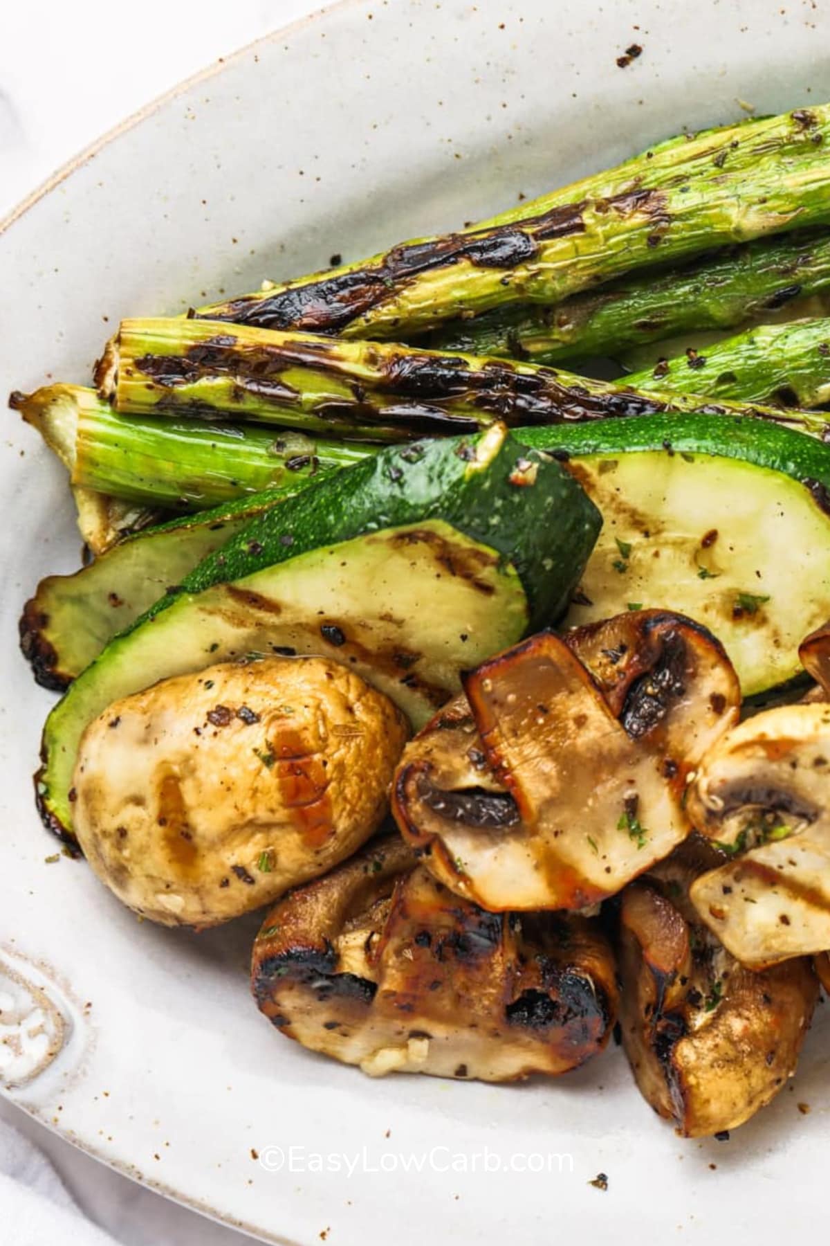 Grilled vegetables, piled together on a plate