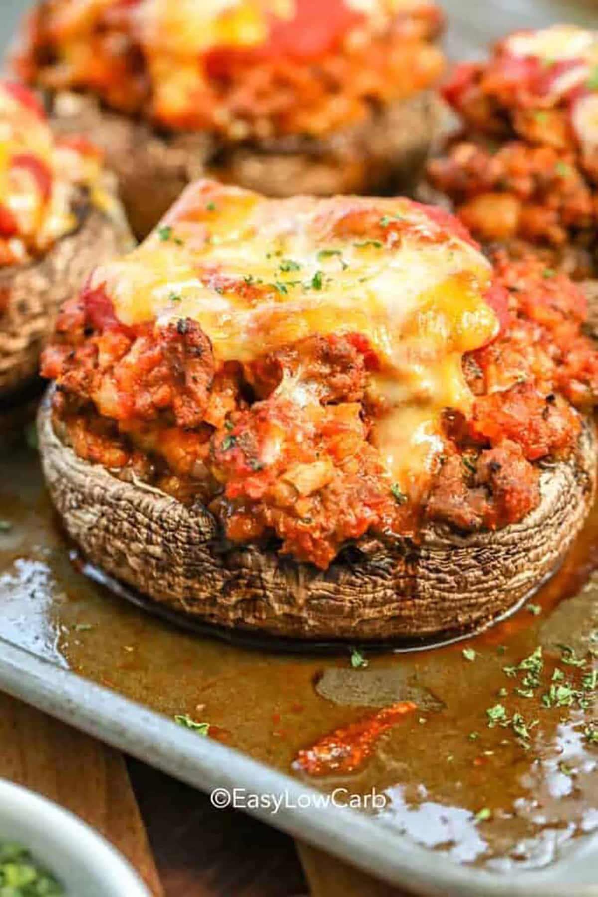 baked stuffed portobello mushroom recipe with melted cheese on the top