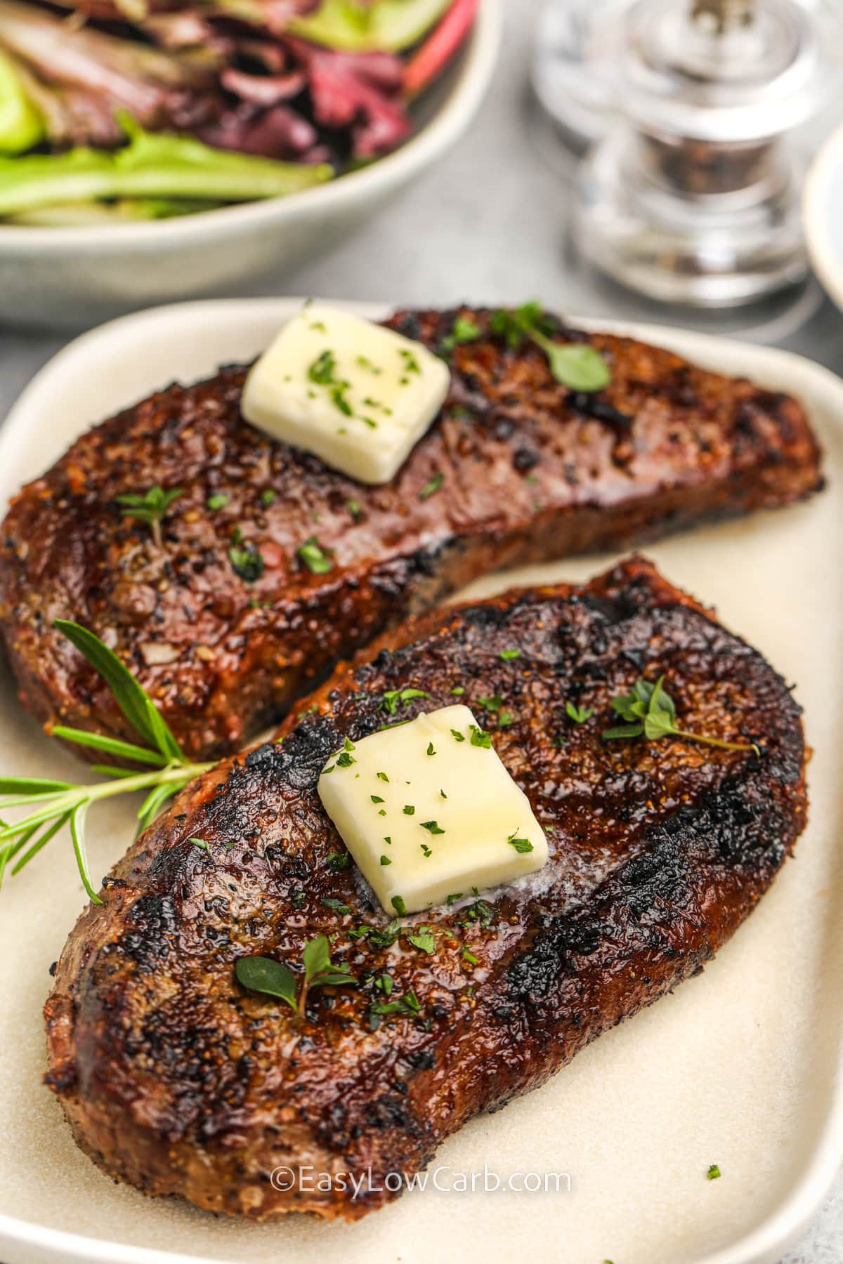 plate of Grilled Sirloin Steak with a bowl of salad