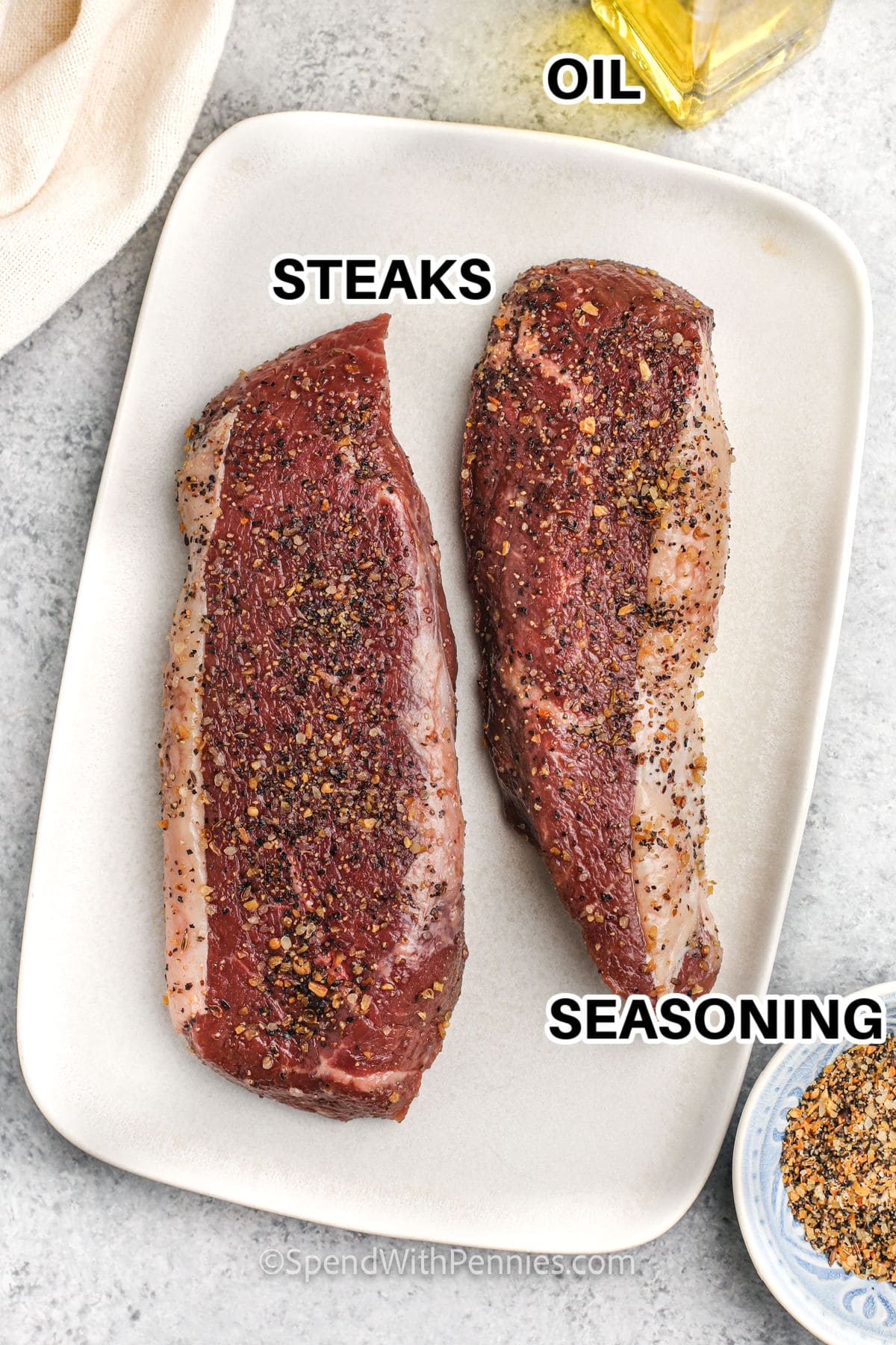 steaks , seasoning and oil to make Grilled Sirloin Steak with labels