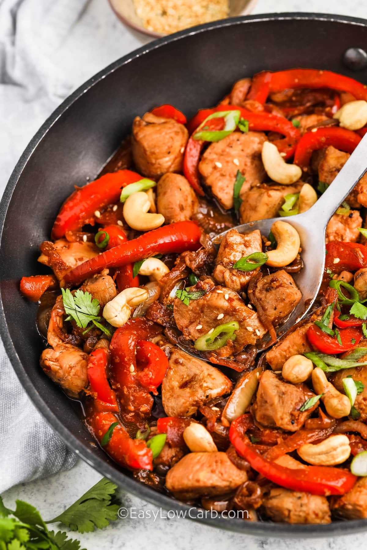 Take a spoonful of Cashew Chicken Recipe out of the pan