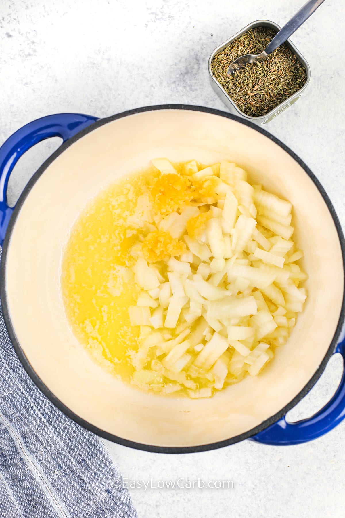 adding oil with garlic and onions to make Homemade Cream of Chicken Soup