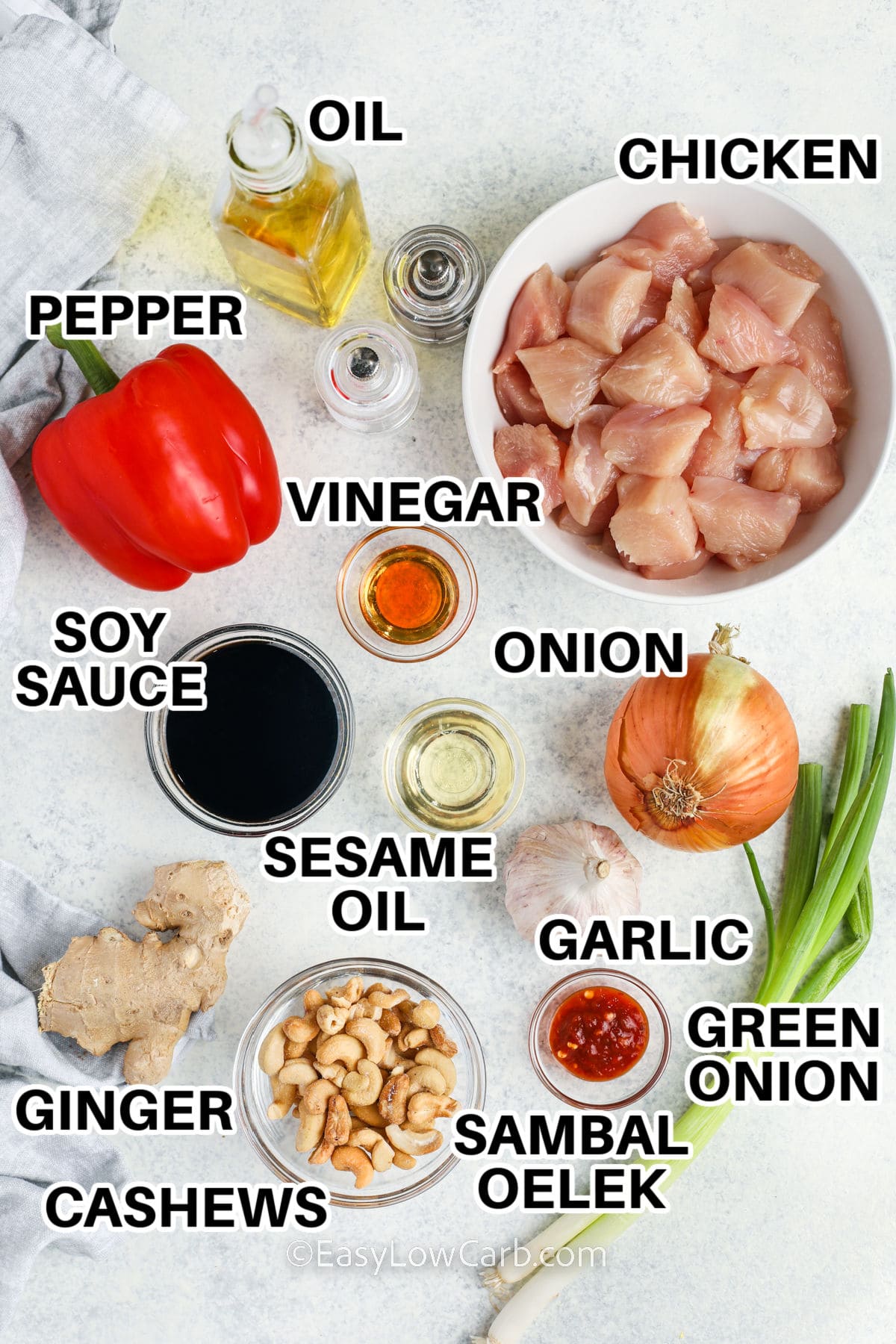 oil , chicken , pepper , vinegar , soy sauce , sesame oil , onion , garlic , green onion , sambal oelek , ginger and cashews with labels to make Cashew Chicken Recipe