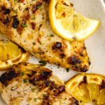 greek yogurt chicken on a plate with text