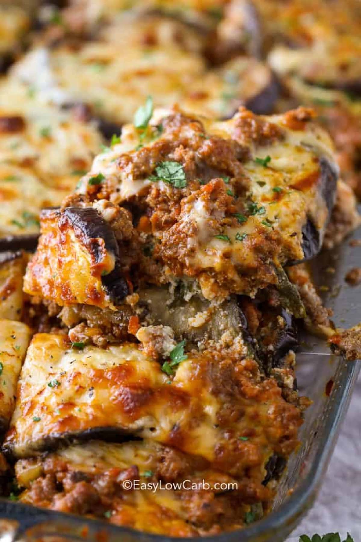 a serving of eggplant lasagna from a clear baking dish