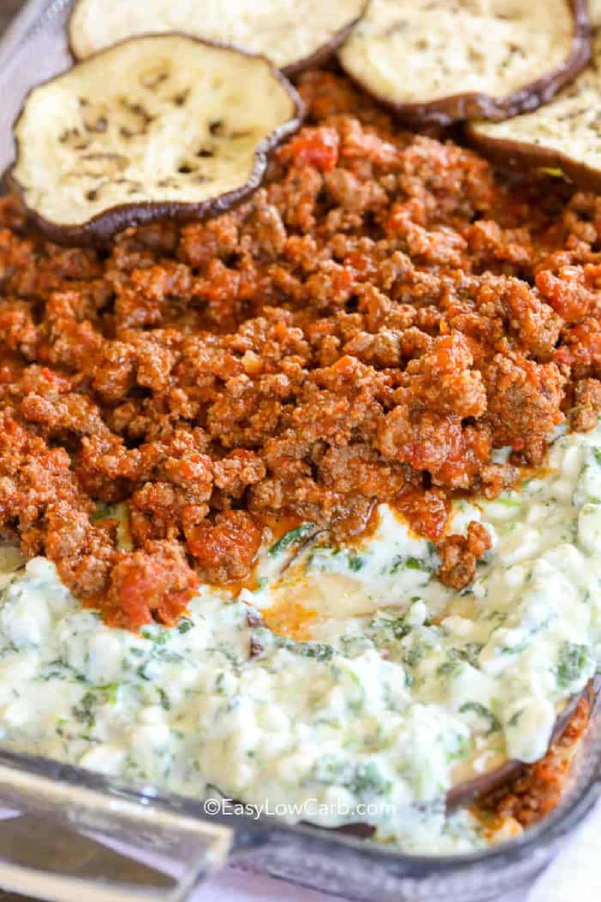 layers assembled in a clear baking dish to make eggplant lasagna