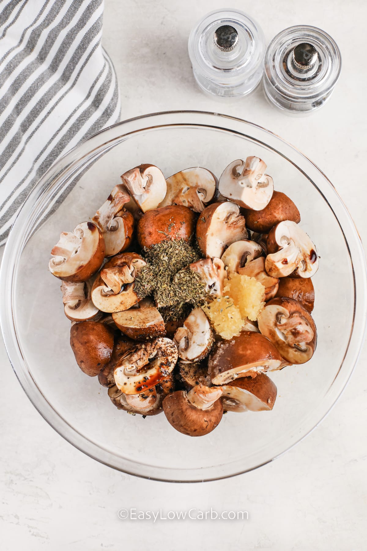 adding ingredients together to make Air Fryer Mushrooms