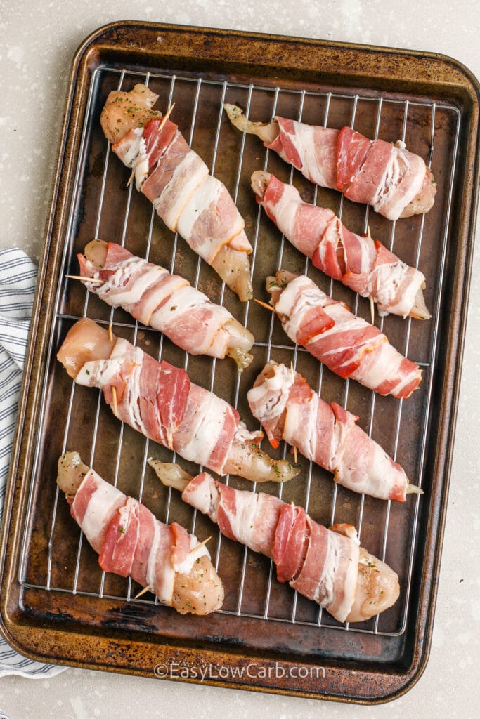 chicken wrapped with bacon a baking tray