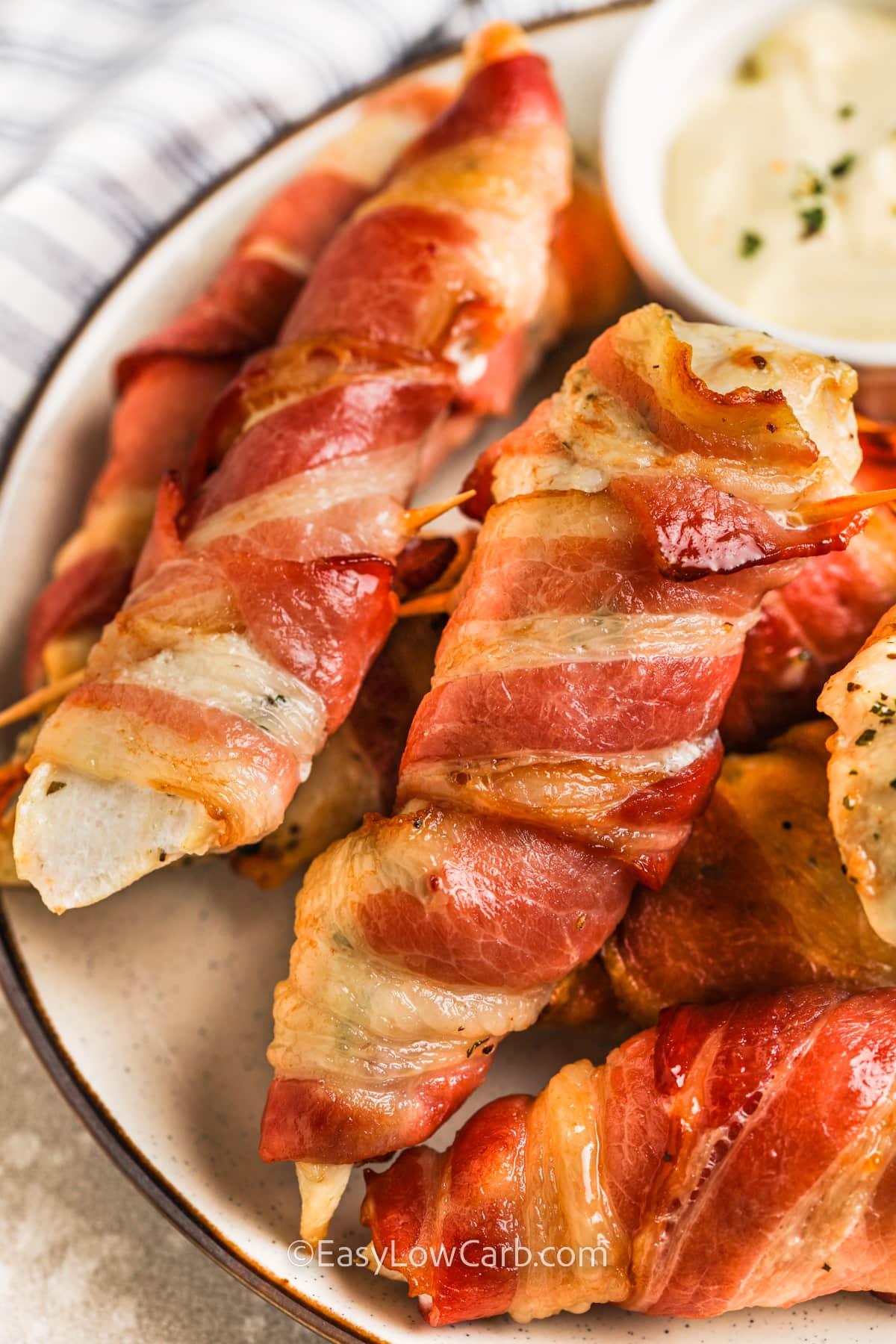 Bacon Wrapped Chicken on a plate with dip