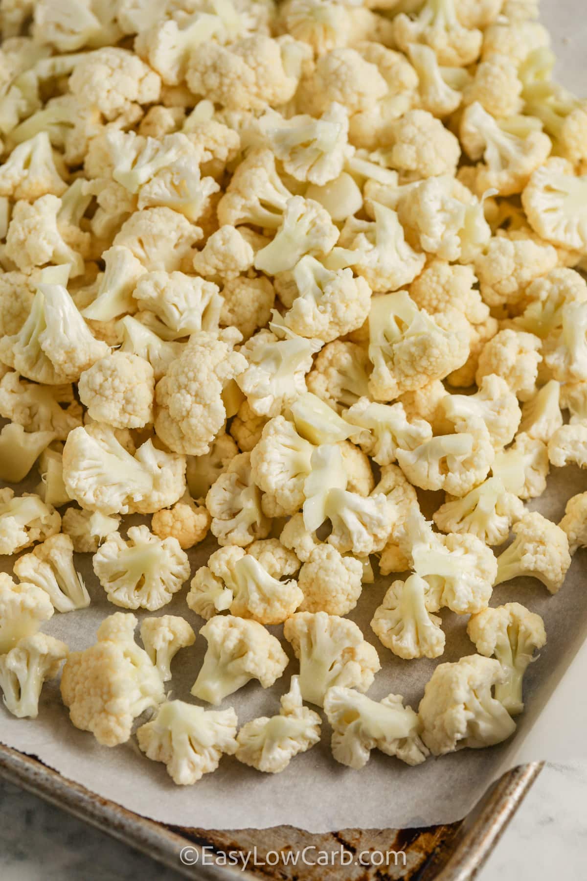 cauliflower on a baking sheet to be baked