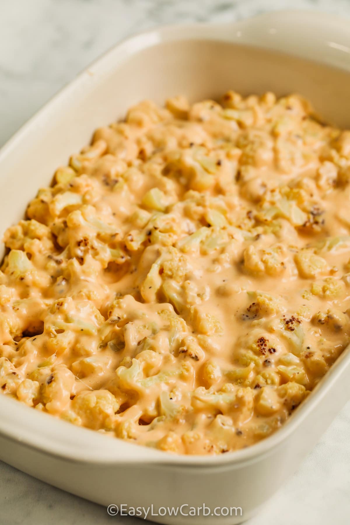 Keto cauliflower mac and cheese prepped in a casserole dish