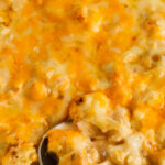 Baked cauliflower mac and cheese being served with text