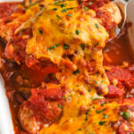 taking a piece of Salsa Chicken Recipe out of the casserole dish