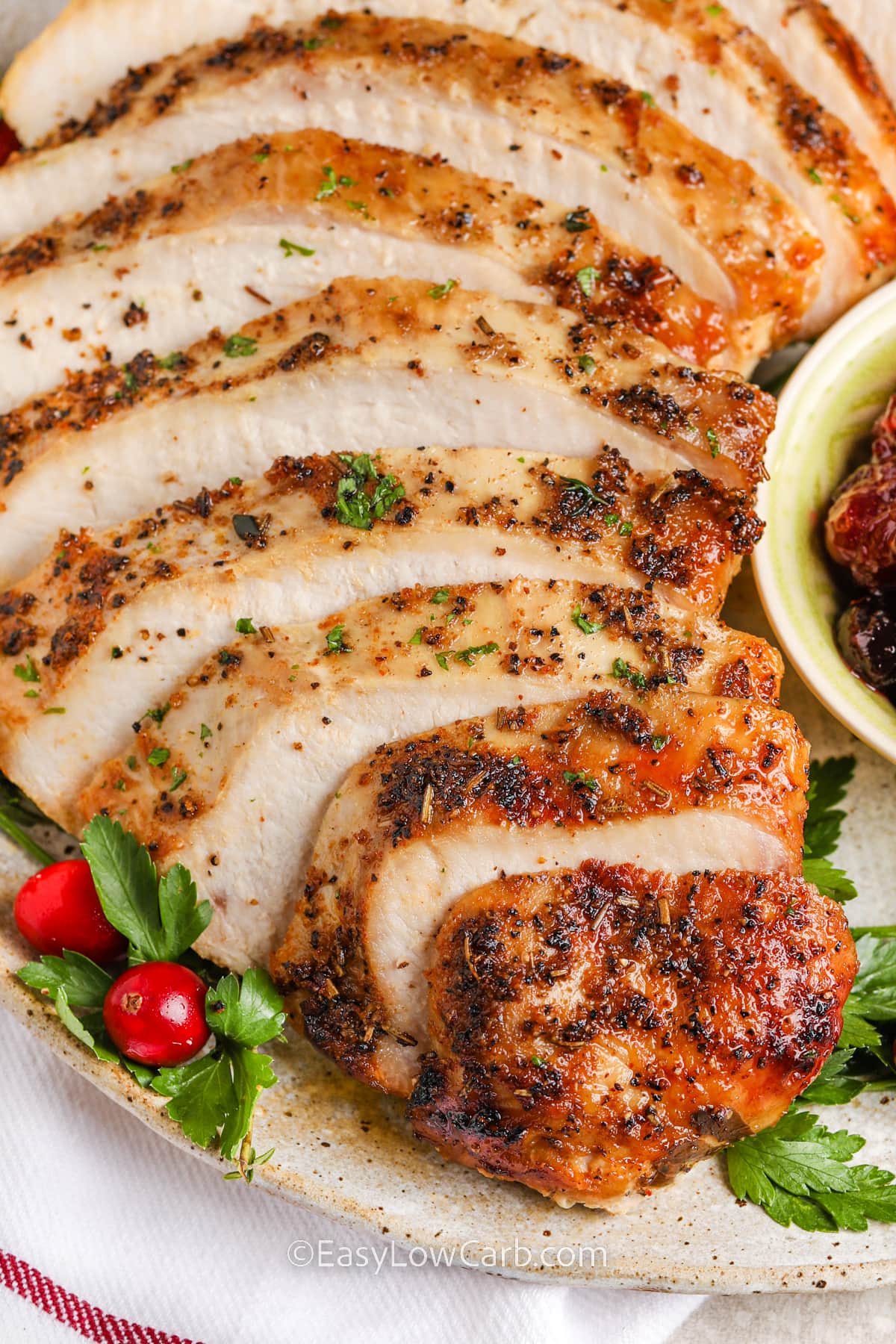 crockpot turkey breast sliced on a plate