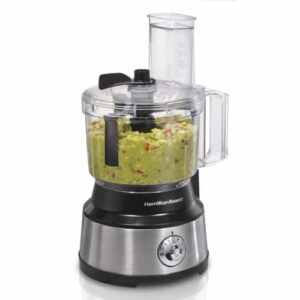 a food processor with guacamole being made in it.