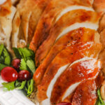 oven roasted turkey sliced on a serving platter