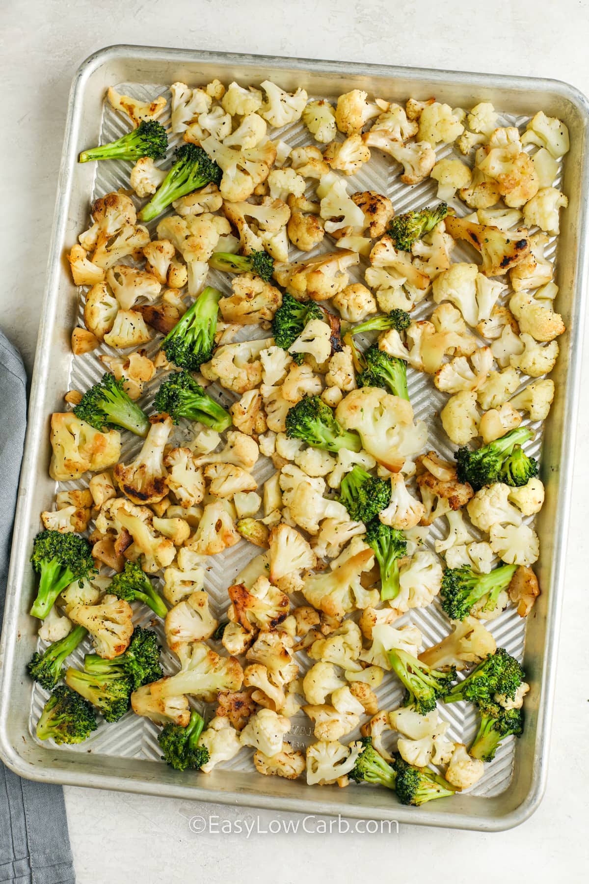 broccoli and cauliflower roasted on a baking sheet