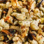a bowl of keto cauliflower stuffing with text