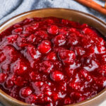 Keto Cranberry Sauce in a bowl with a title