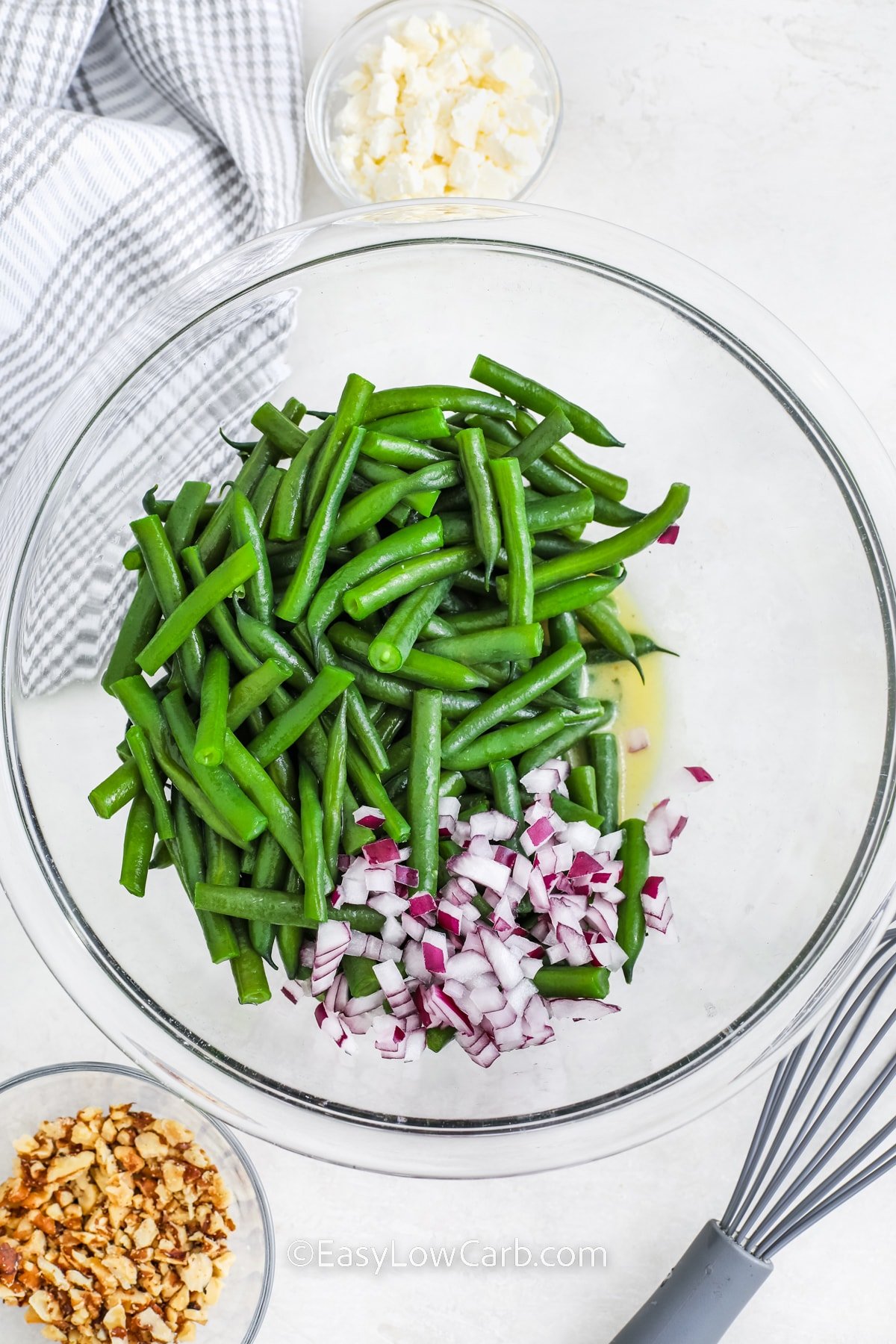 ingredients to make green bean salad in a bowl